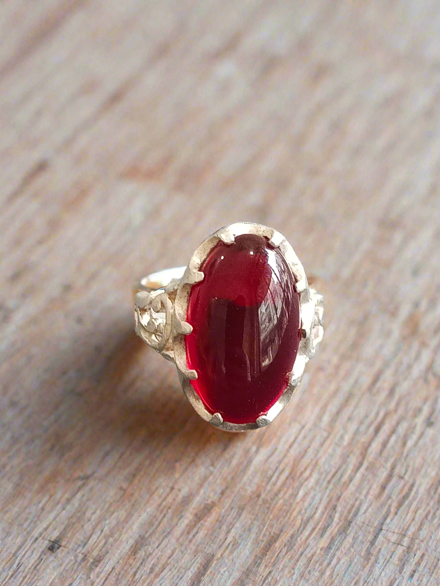 Elegant Silver Ring with Deep Red Oval Gemstone
