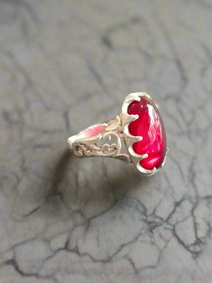 Elegant Silver Ring with Deep Red Oval Gemstone