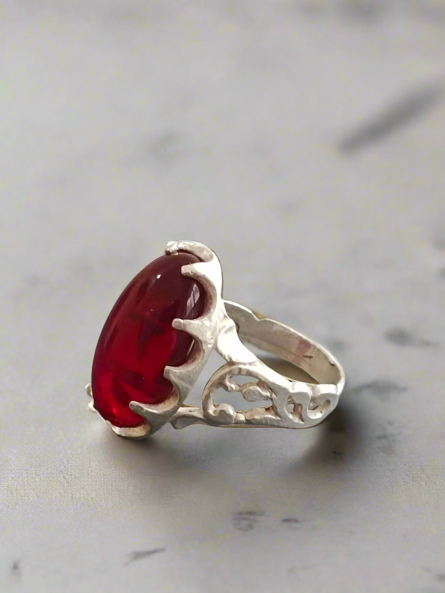 Elegant Silver Ring with Deep Red Oval Gemstone