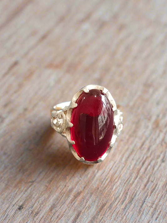 Elegant Silver Ring with Deep Red Oval Gemstone